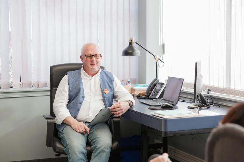 Registered First Nations therapy practitioner at a desk in Belleville providing mental health support and resources.
