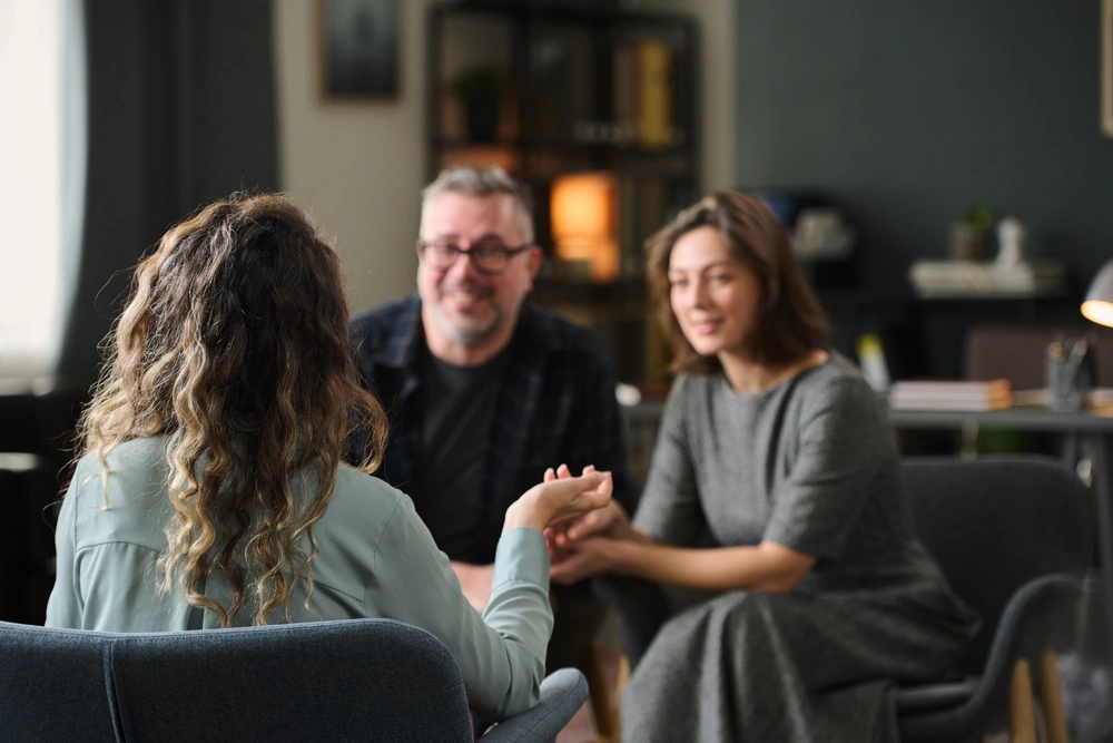 Couple engaged in veterans counselling services with a professional therapist